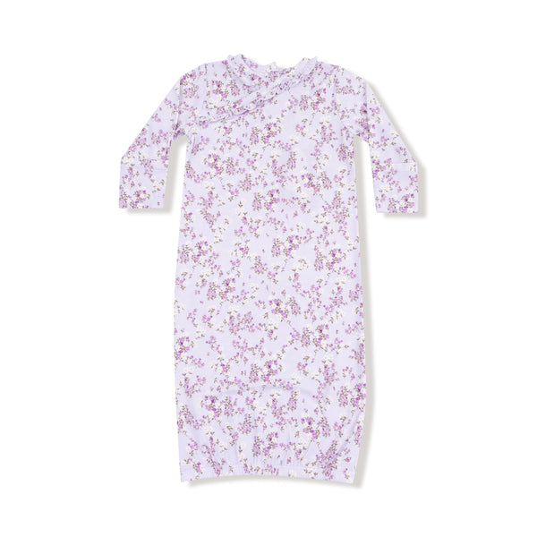 Lavender kimono-style baby gown with floral print, ruffle neckline, long sleeves, and elastic bottom hem for easy dressing.

