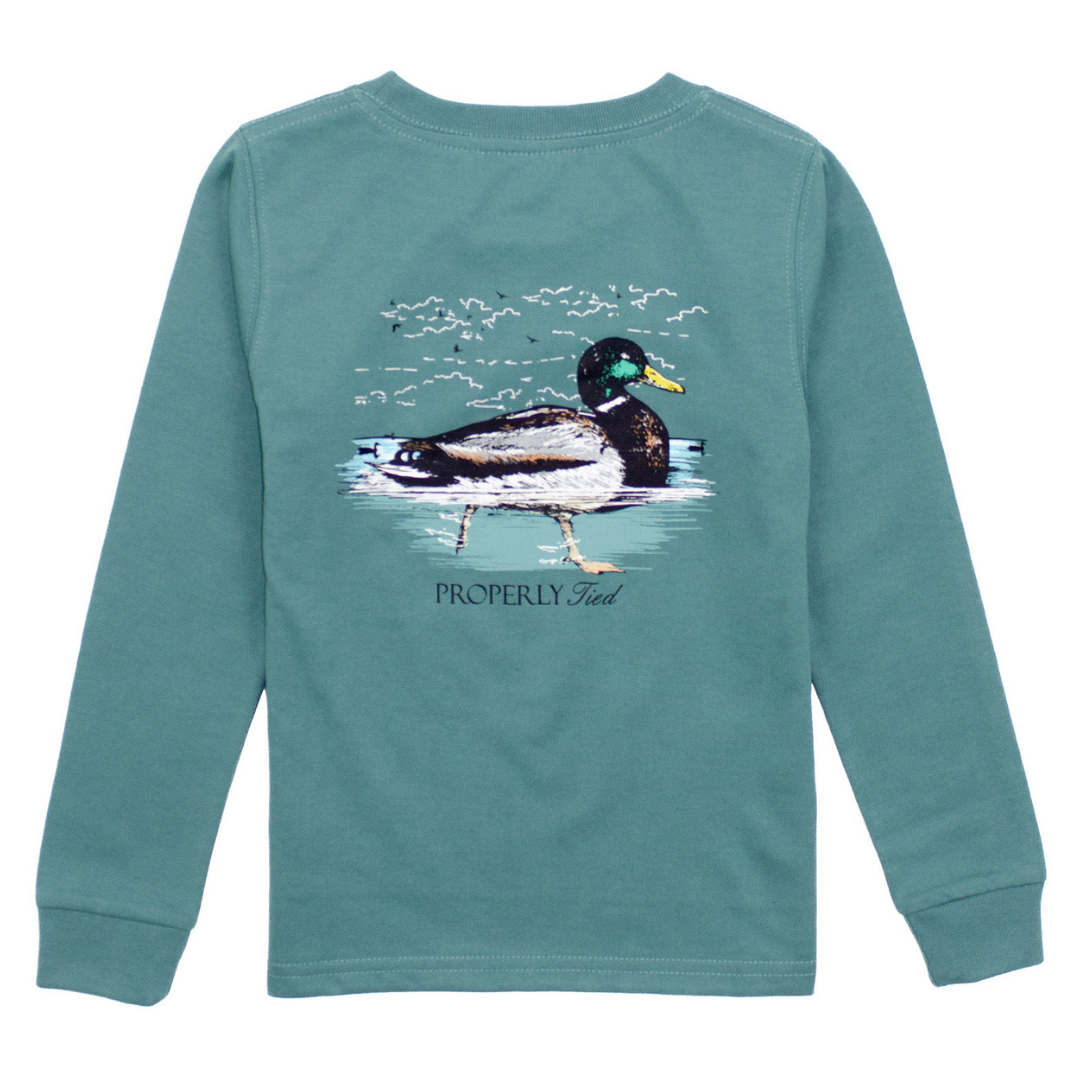 Boys’ marine green long sleeve shirt with graphic of a mallard duck swimming in water and Properly Tied logo below


