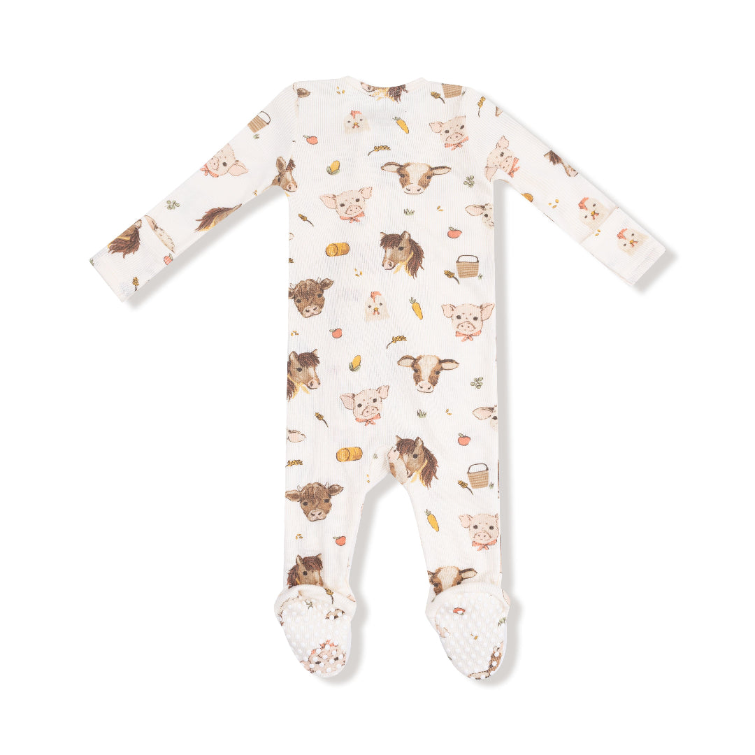 Back view of baby footie with allover print of watercolor farm animals including pigs, cows, horses, and chicks

