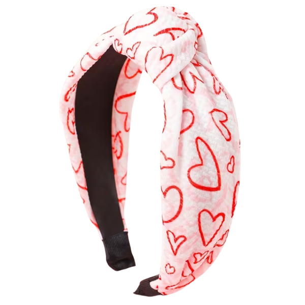Headband with red  and pink heart patterns on a white background
