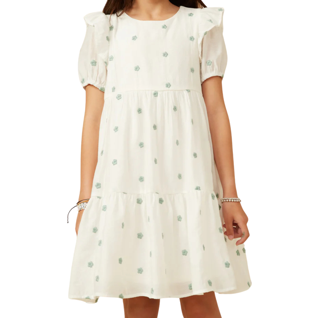 White dress with embroidered green flowers. 