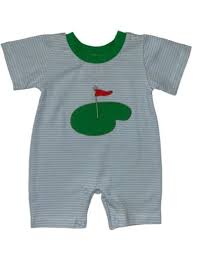 Blue romper with white stripes and a green trim on the coller. Has a golf course with a red flag as an applique on the front. 