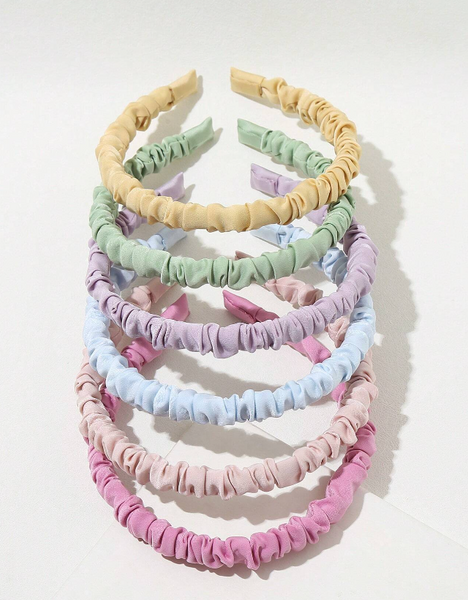 Ruched headbands that are pastel colors. 