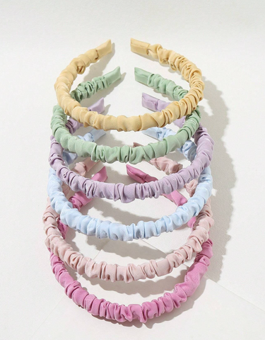 Ruched headbands that are pastel colors. 