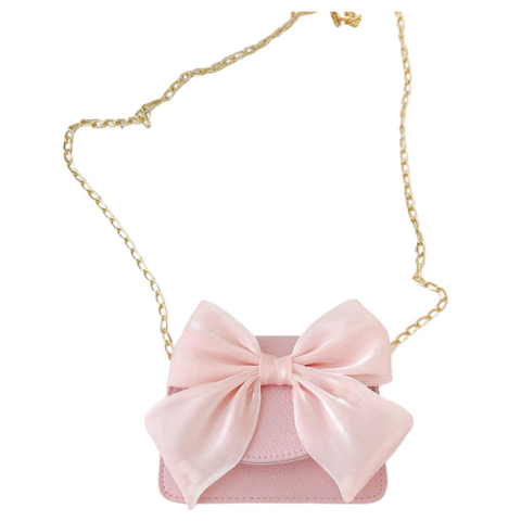 Pink leather purse with pink bow, plus gold chain as purse strap. 