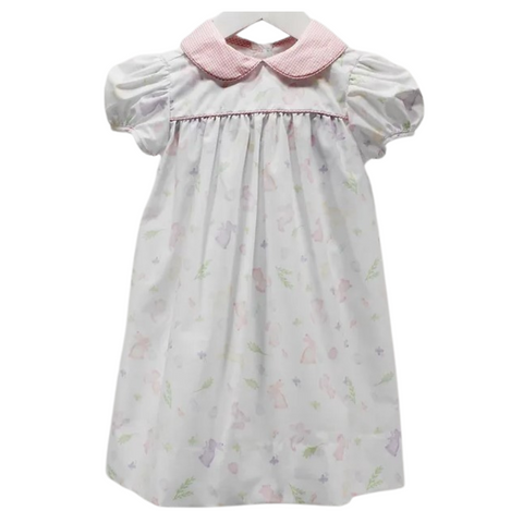 Traditional style empire girl's dress with short sleeves.  Fabric is printed with pastel bunnies and it has a coordinating pink gingham collar